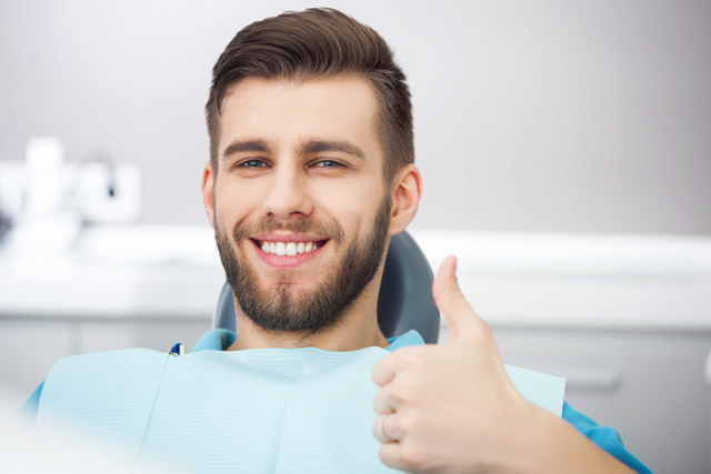 Happy man during dental checkup